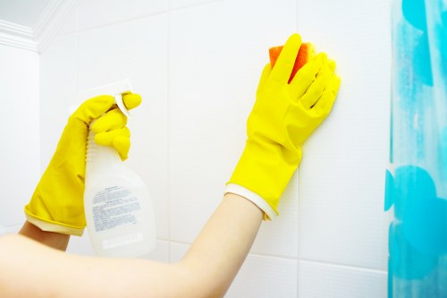 Technician carrying out safe oven cleaning in Wembley with protective equipment